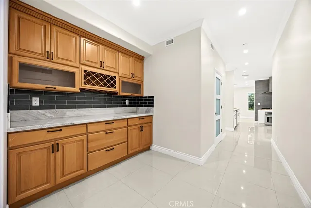 a kitchen with stainless steel appliances granite countertop a stove and a sink