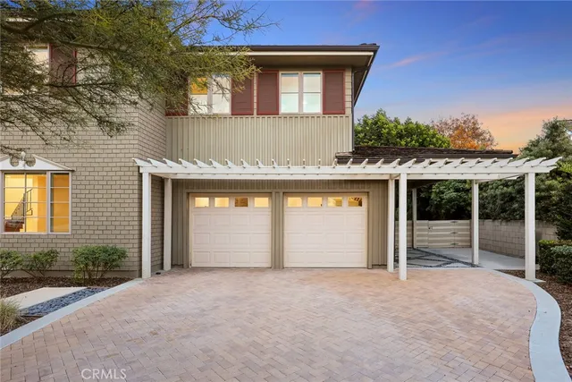 an aerial view of residential houses with city view