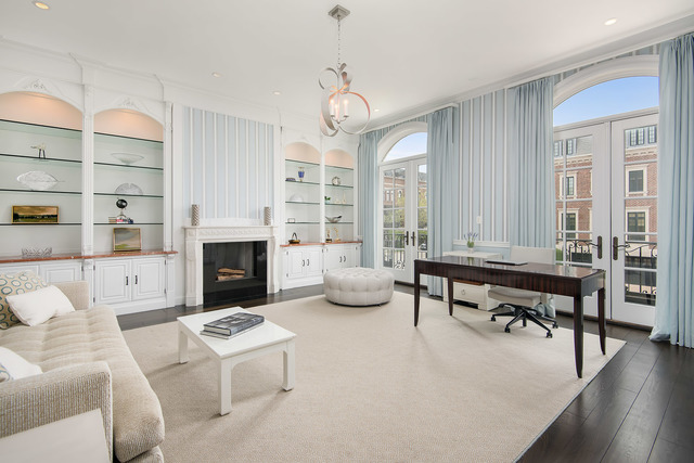 1746 West Surf Street Chicago, IL 60657 - Photo 13 of 37 a living room with furniture a fireplace and a chandelier
