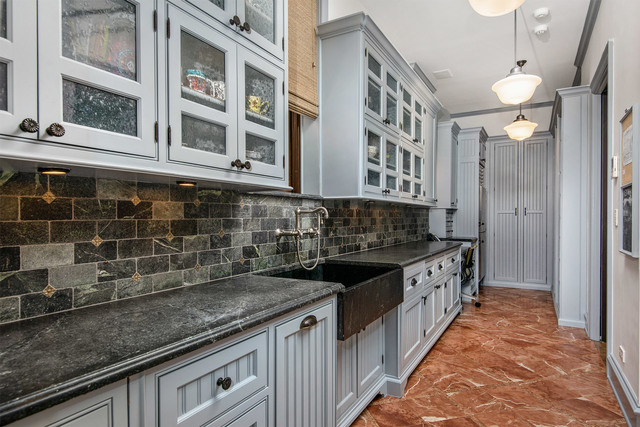 1746 West Surf Street Chicago, IL 60657 - Photo 19 of 37 a kitchen with granite countertop a sink and a stove