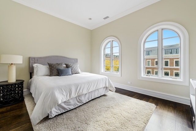 1746 West Surf Street Chicago, IL 60657 - Photo 25 of 37 a bedroom with a bed and a window