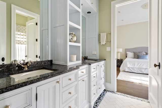 1746 West Surf Street Chicago, IL 60657 - Photo 26 of 37 a en suite bathroom with double sink and a mirror