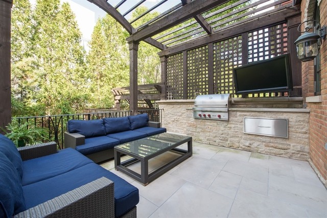 1746 West Surf Street Chicago, IL 60657 - Photo 4 of 37 a living room with furniture and a flat screen tv