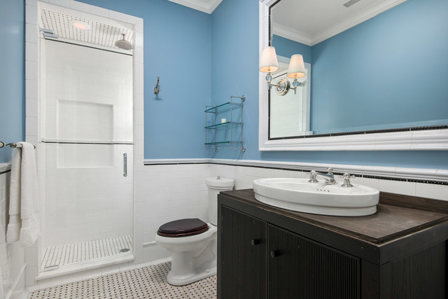 1746 West Surf Street Chicago, IL 60657 - Photo 36 of 37 a bathroom with a sink a toilet and shower