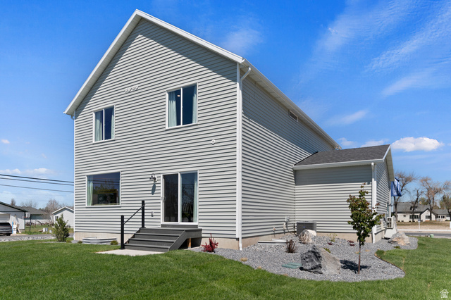 2819 South 710th West, Unit 14 Logan, UT 84321 - Photo 6 of 24 Two-story residence featuring light gray horizontal siding and a dark gray shingle roof