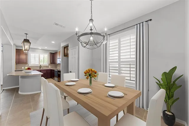 a view of a dining room and livingroom with furniture window