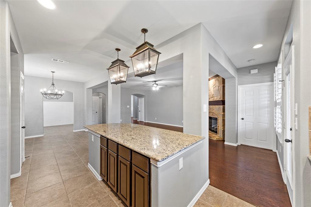 1901 Fair Parke Lane Wylie, TX 75098 - Photo 16 of 37 a kitchen with a sink a counter space and stainless steel appliances