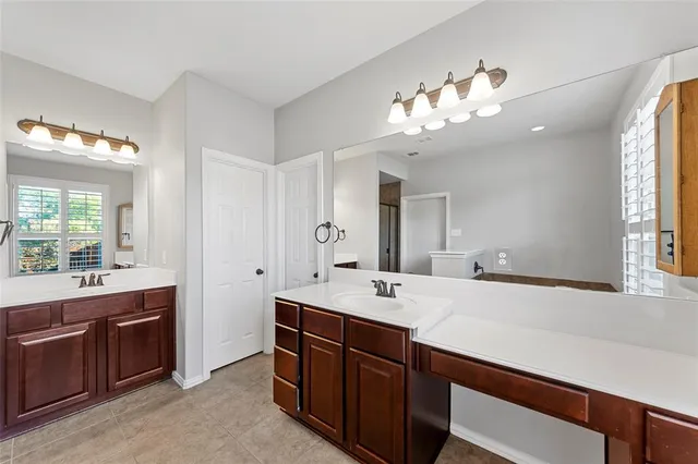 a bathroom with a sink double vanity and a mirror