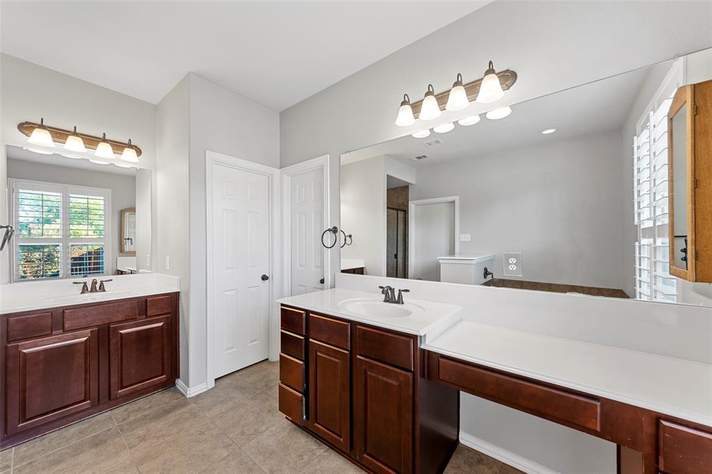 1901 Fair Parke Lane Wylie, TX 75098 - Photo 24 of 37 a bathroom with a sink double vanity and a mirror