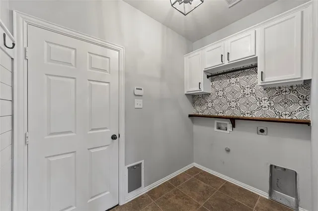 a view of kitchen cabinets and microwave