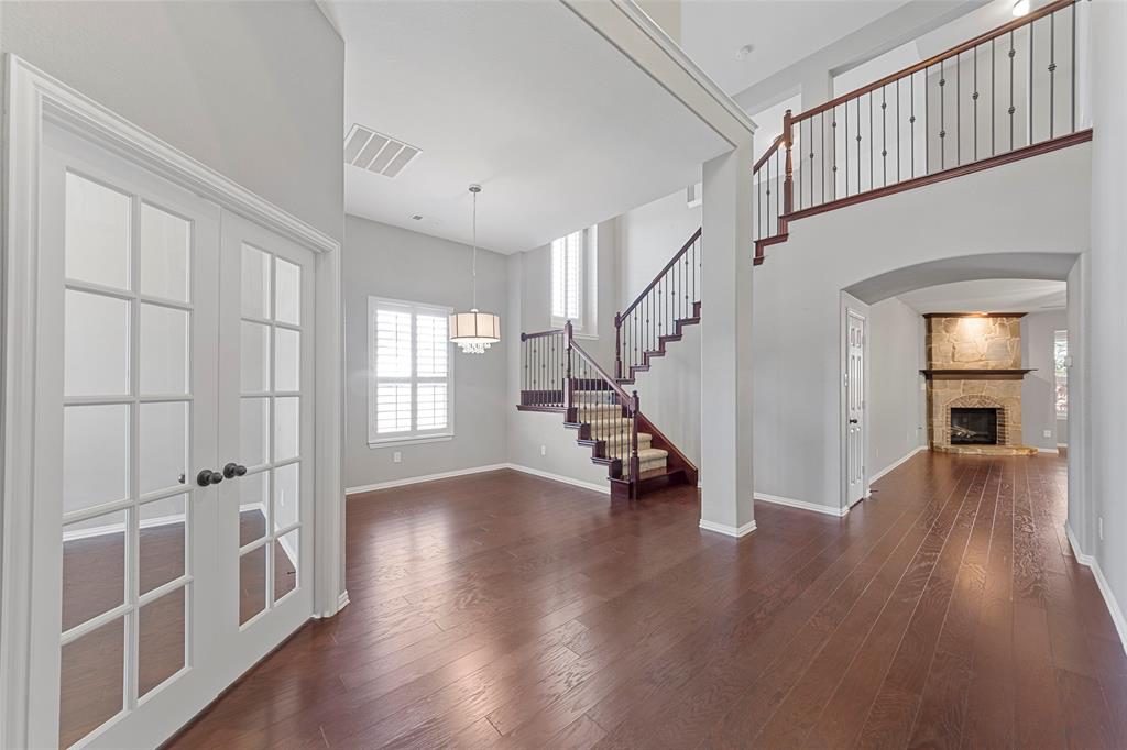 1901 Fair Parke Lane Wylie, TX 75098 - Photo 7 of 37 a view of an entryway with wooden floor and stairs