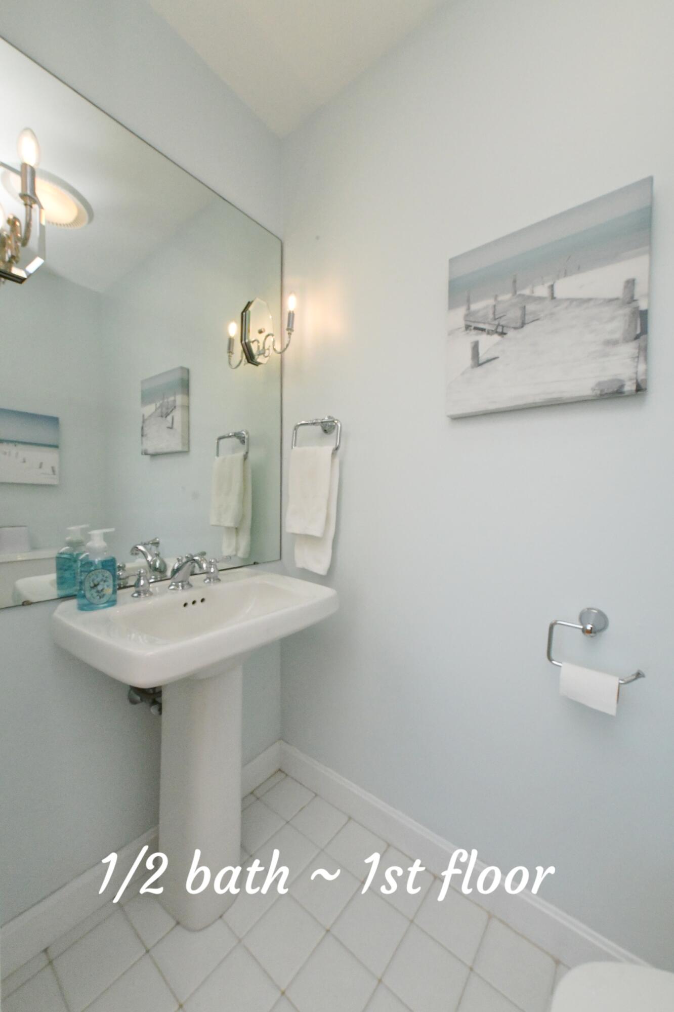 4 Bittersweet Lane, Unit 4G Buzzards Bay, MA 02532 - Photo 18 of 26 a bathroom with a sink and a mirror