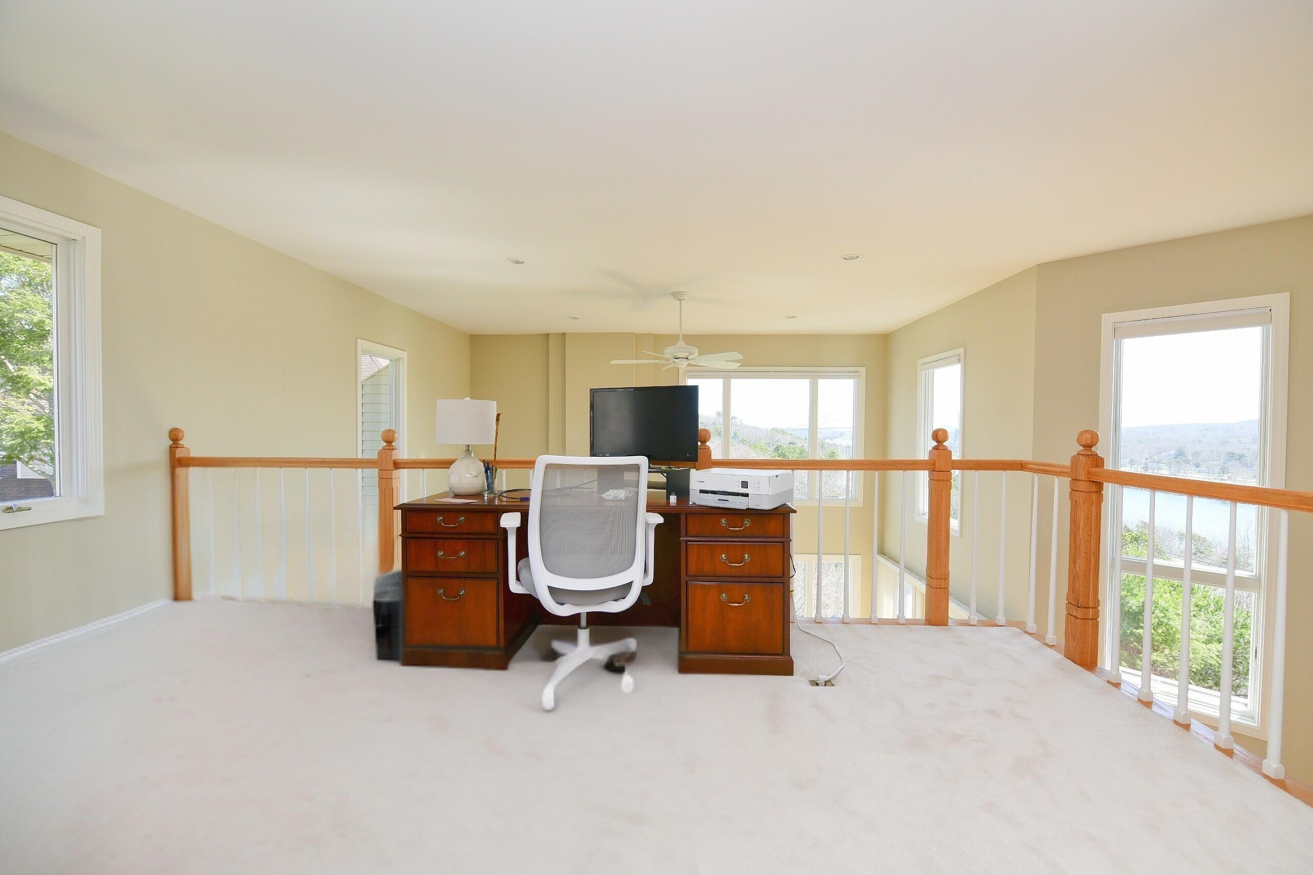 4 Bittersweet Lane, Unit 4G Buzzards Bay, MA 02532 - Photo 21 of 26 a view of living room filled with furniture and a floor to ceiling window