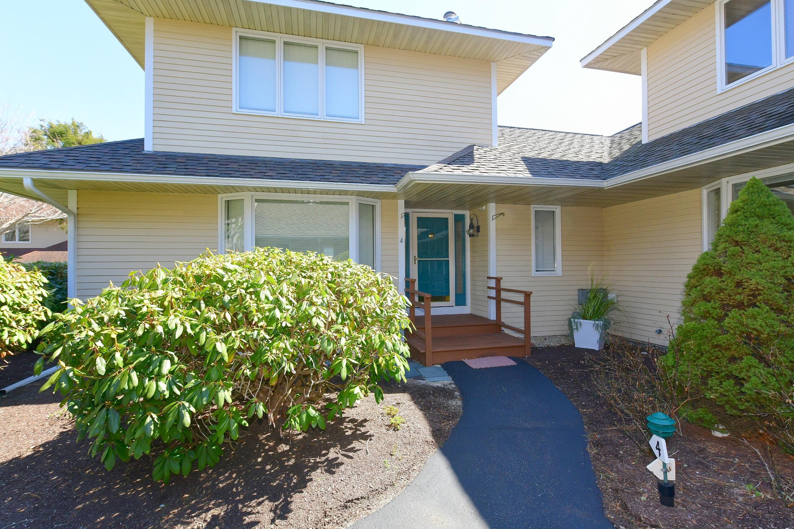4 Bittersweet Lane, Unit 4G Buzzards Bay, MA 02532 - Photo 23 of 26 a front view of a house with garden