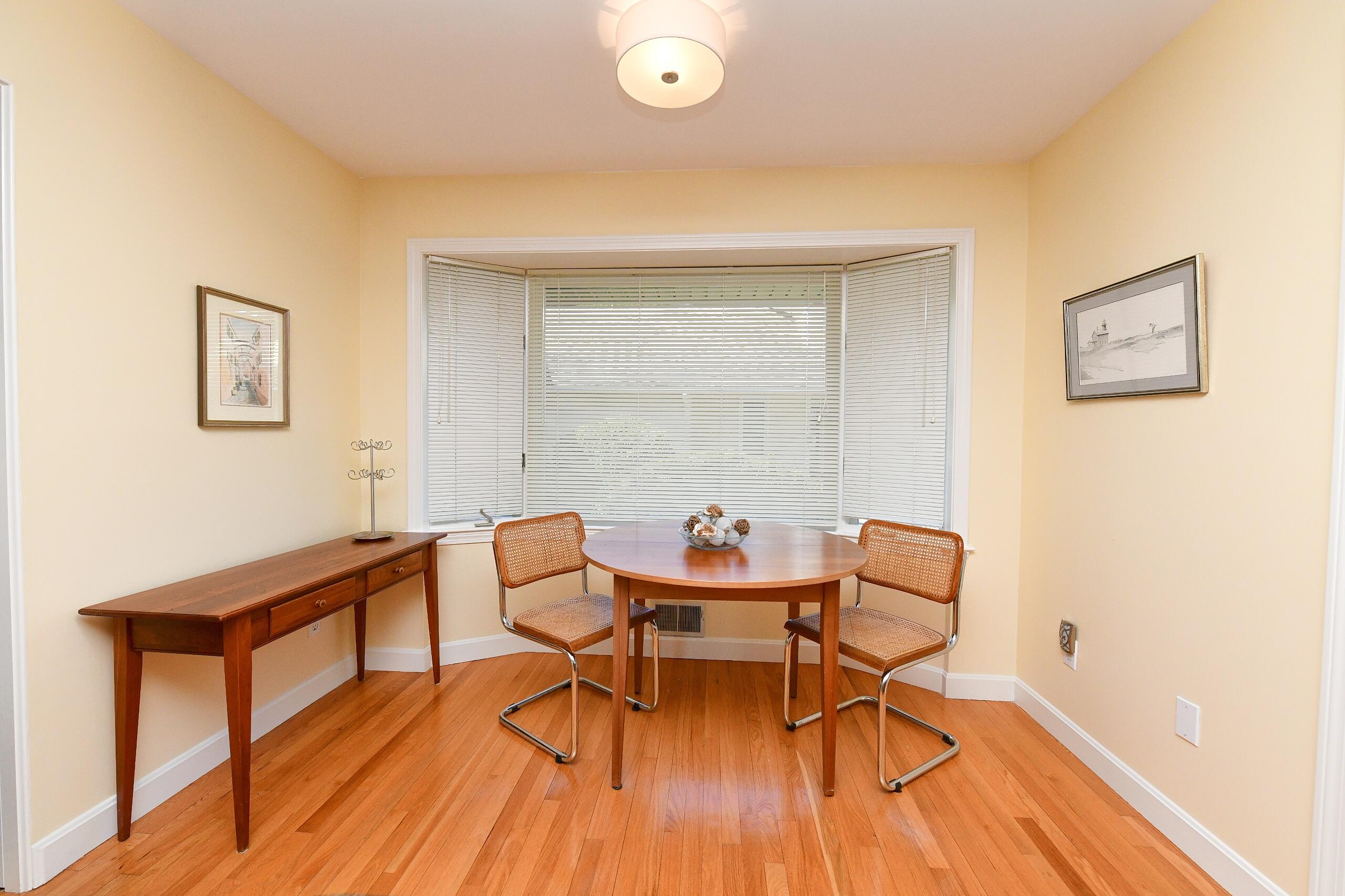 4 Bittersweet Lane, Unit 4G Buzzards Bay, MA 02532 - Photo 5 of 26 a living room with furniture and a wooden floor