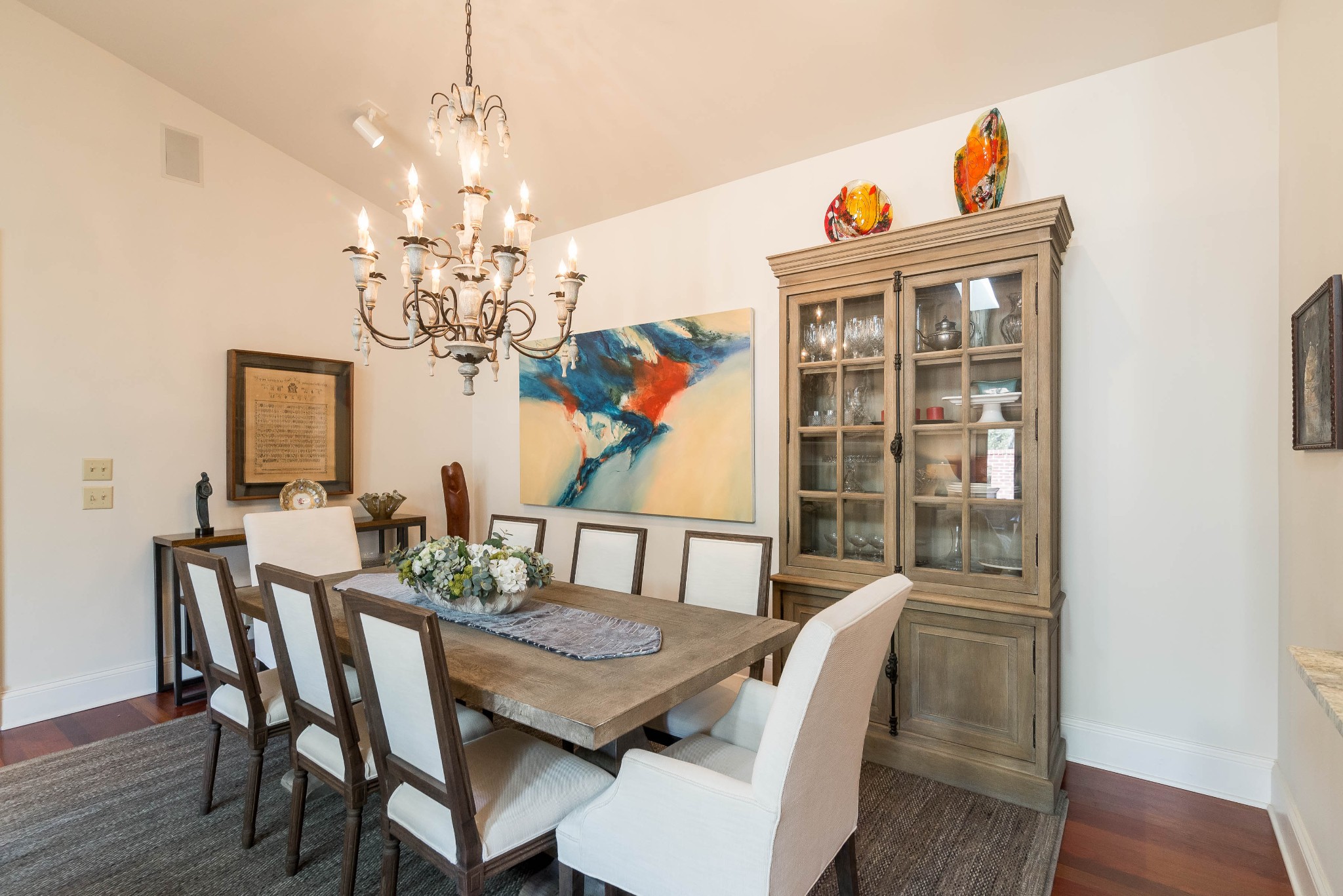 4122 Sneed Road Nashville, TN 37215 - Photo 3 of 16 a view of a dining room with furniture a chandelier and wooden floor