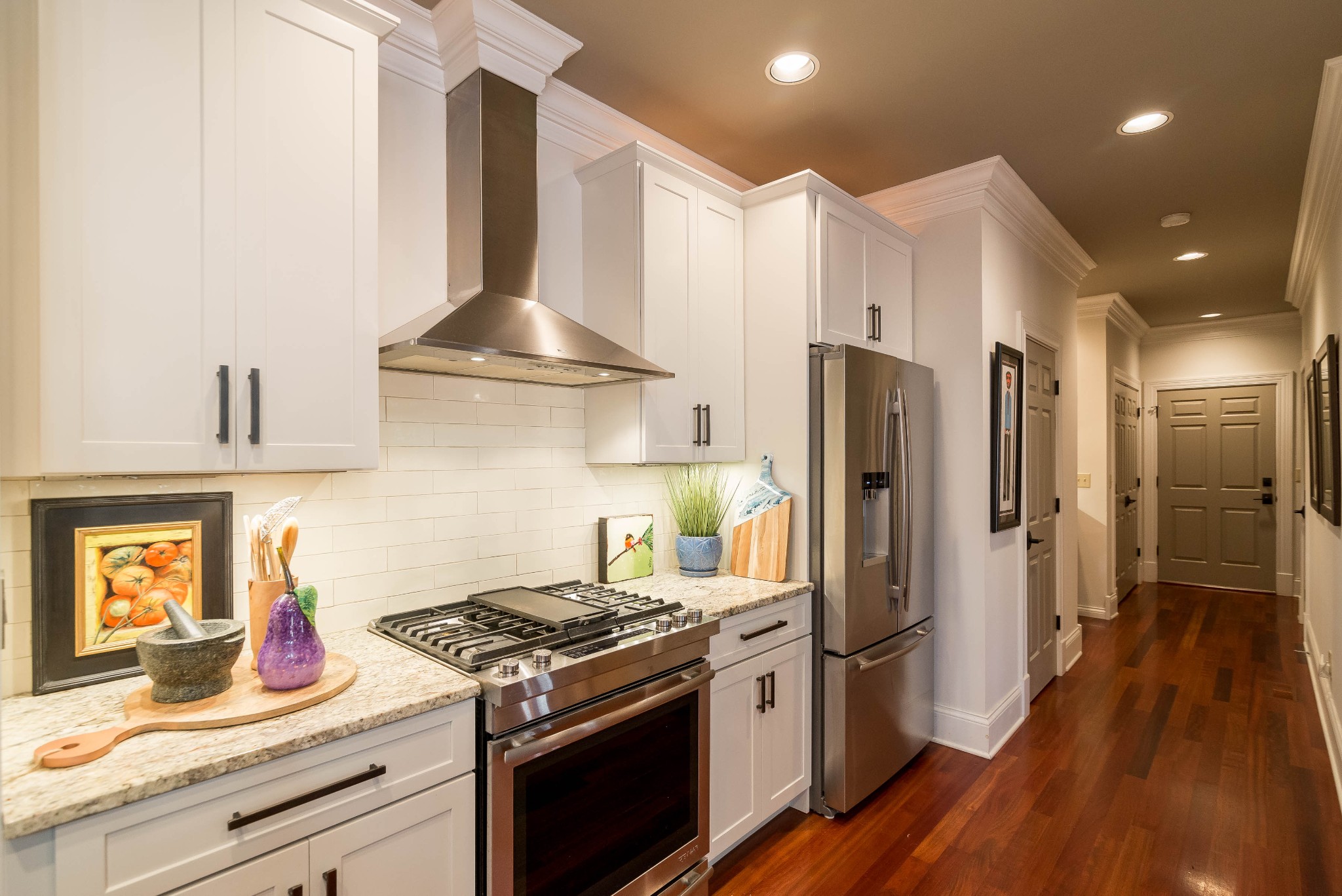 4122 Sneed Road Nashville, TN 37215 - Photo 5 of 16 a kitchen with stainless steel appliances granite countertop a refrigerator a stove and a sink with wooden floor