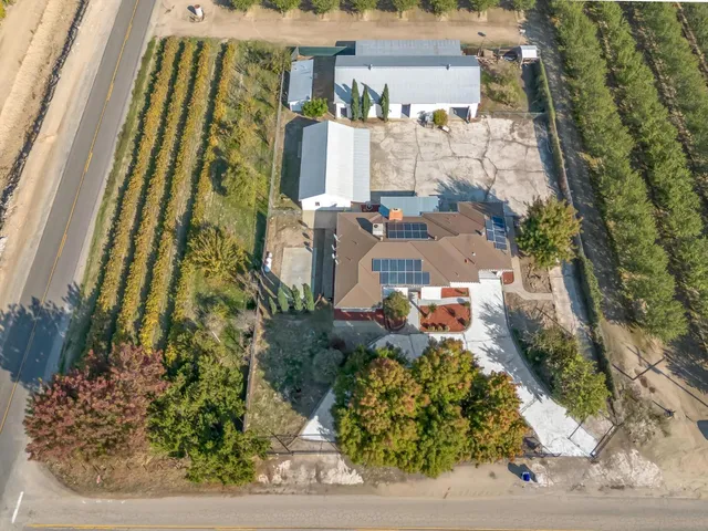a view of a street with trees on both side of it