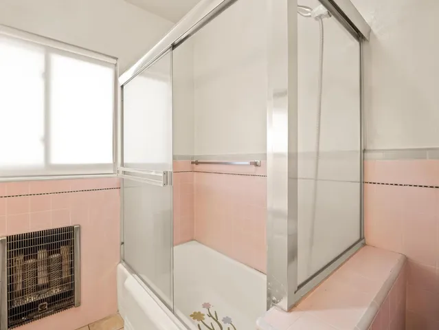 a white toilet sitting next to a bathroom sink