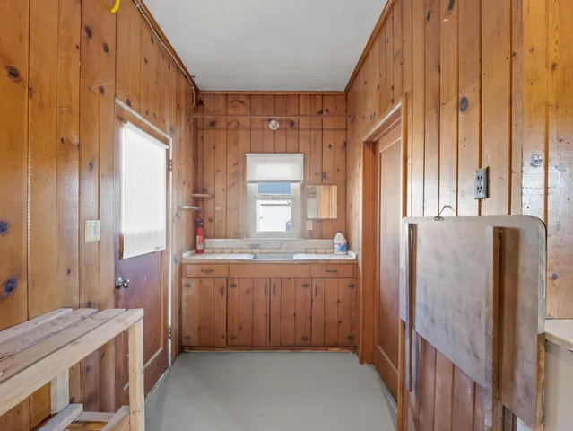 a kitchen with stainless steel appliances granite countertop a stove and a sink