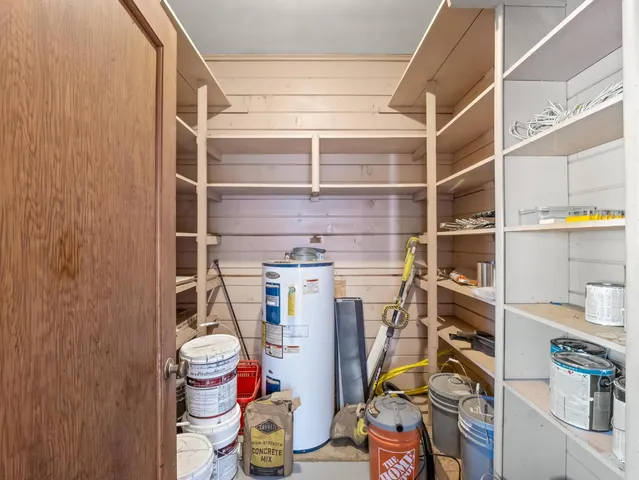a view of a patio with a table and chairs