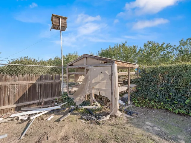 a bedroom with bed and cabinets