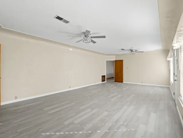 a kitchen with stainless steel appliances granite countertop a refrigerator a sink and a stove