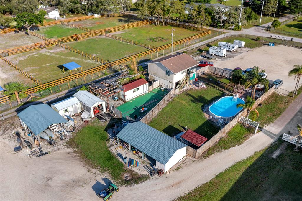7705 Gardner Road Tampa, FL 33625 - Photo 17 of 51 an aerial view of a pool yard swimming pool and outdoor seating