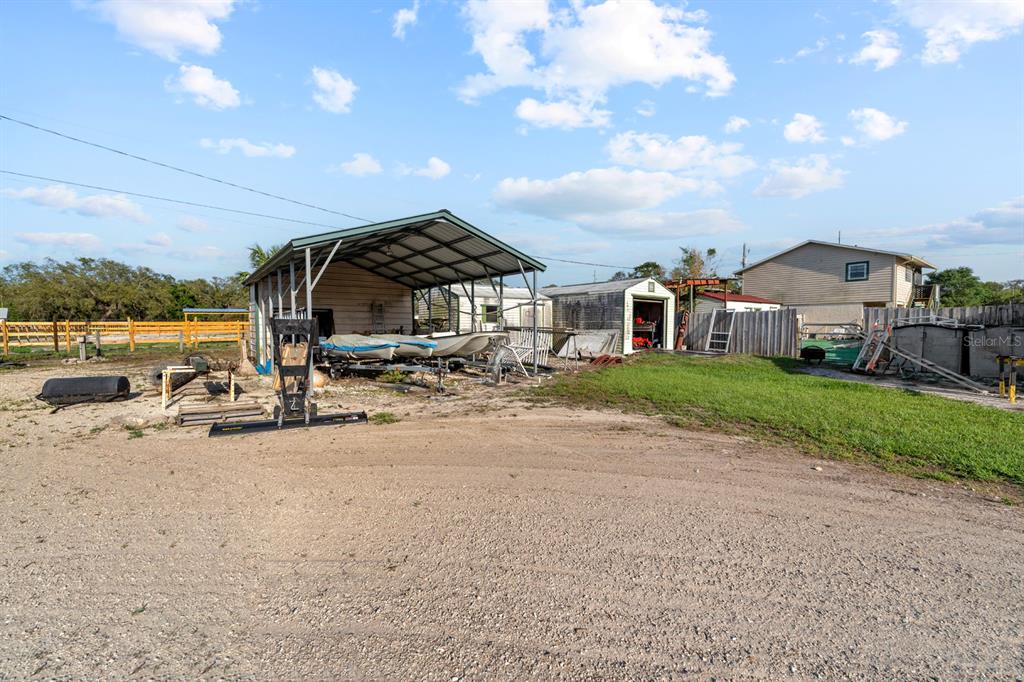 7705 Gardner Road Tampa, FL 33625 - Photo 19 of 51 a view of a large house with a yard
