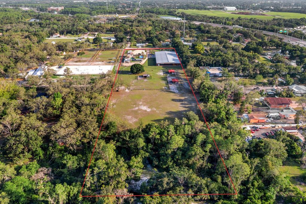 7705 Gardner Road Tampa, FL 33625 - Photo 49 of 51 an aerial view of residential houses with outdoor space and trees