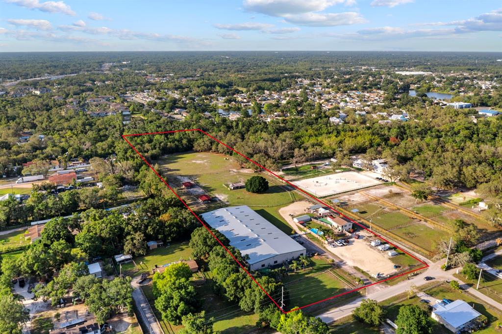 7705 Gardner Road Tampa, FL 33625 - Photo 50 of 51 an aerial view of residential houses with outdoor space