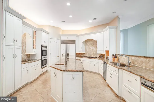 a spacious bedroom with a bed and wooden floor
