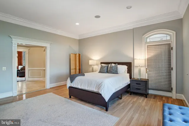 a kitchen with stainless steel appliances kitchen island granite countertop a table and chairs in it