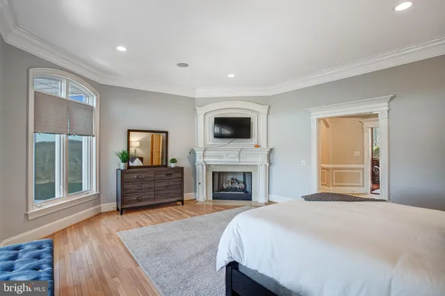 a kitchen with granite countertop white cabinets and black stainless steel appliances