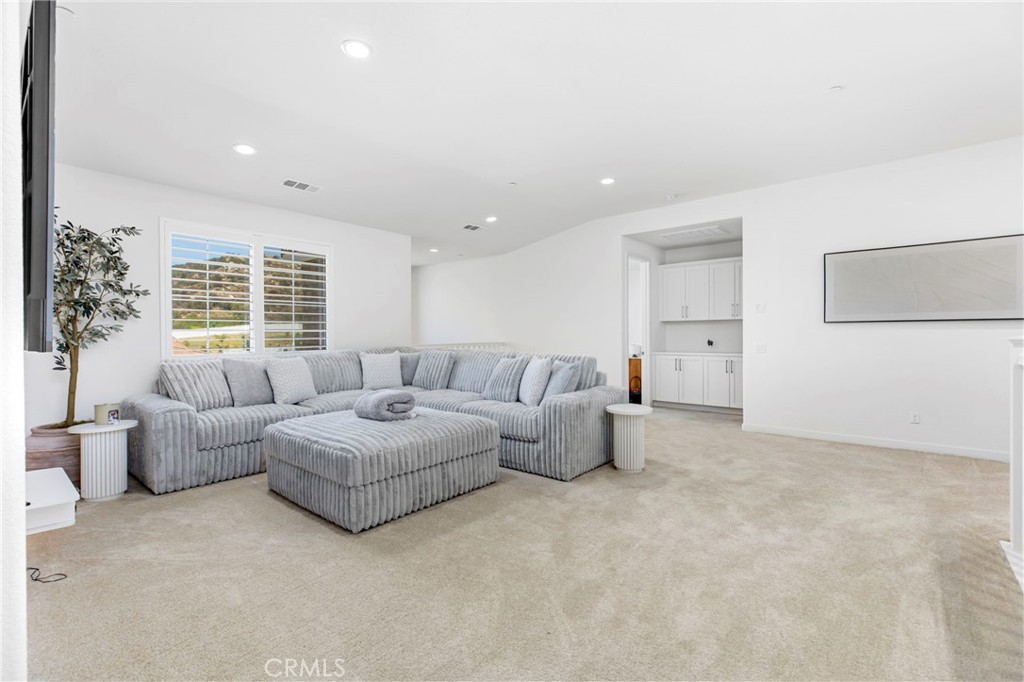 32797 Hayden Road Menifee, CA 92584 - Photo 21 of 51 a living room with furniture and a large window