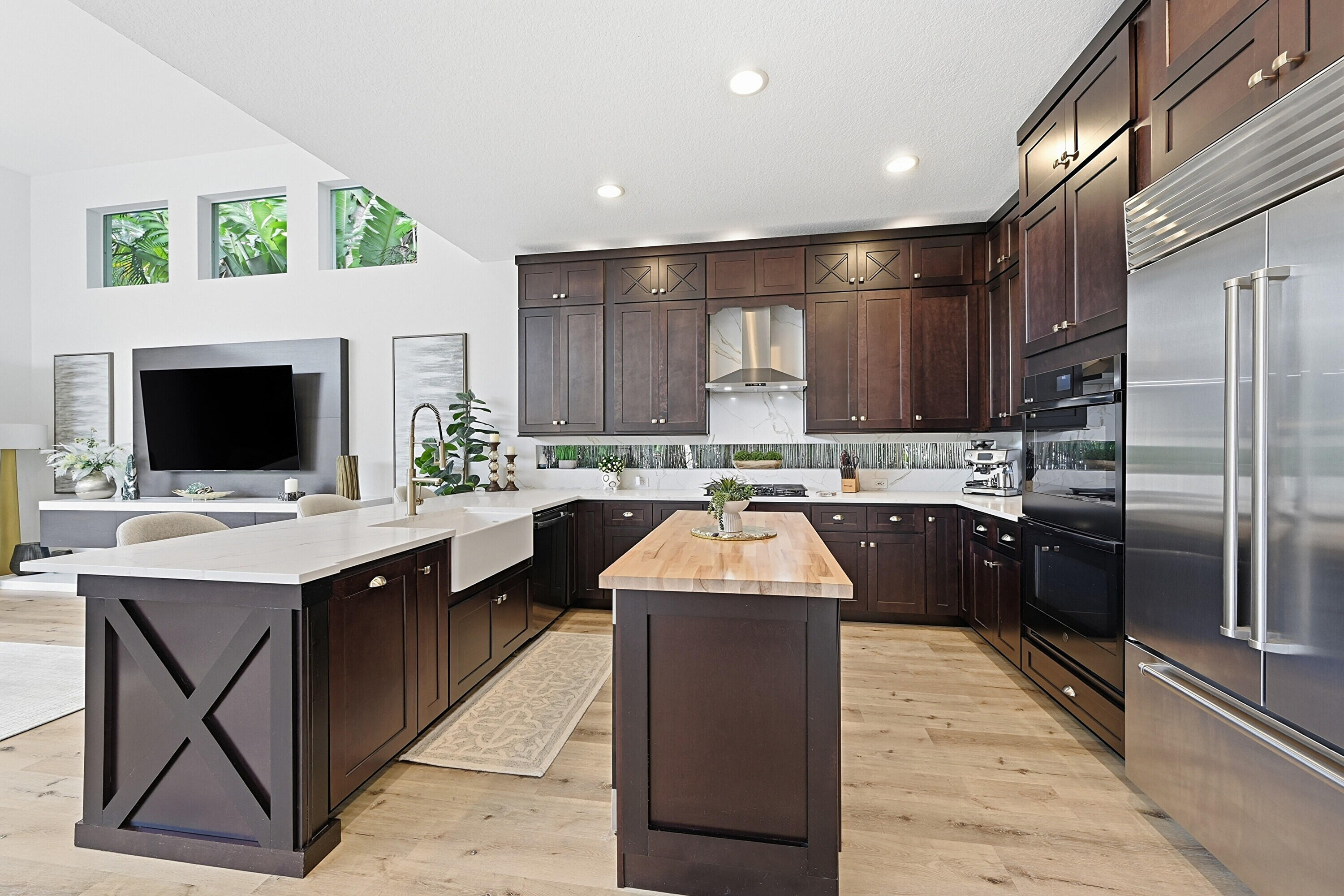 2399 Northwest 49th Lane Boca Raton, FL 33431 - Photo 20 of 75 a kitchen with stainless steel appliances kitchen island granite countertop a sink dishwasher stove top oven and cabinets