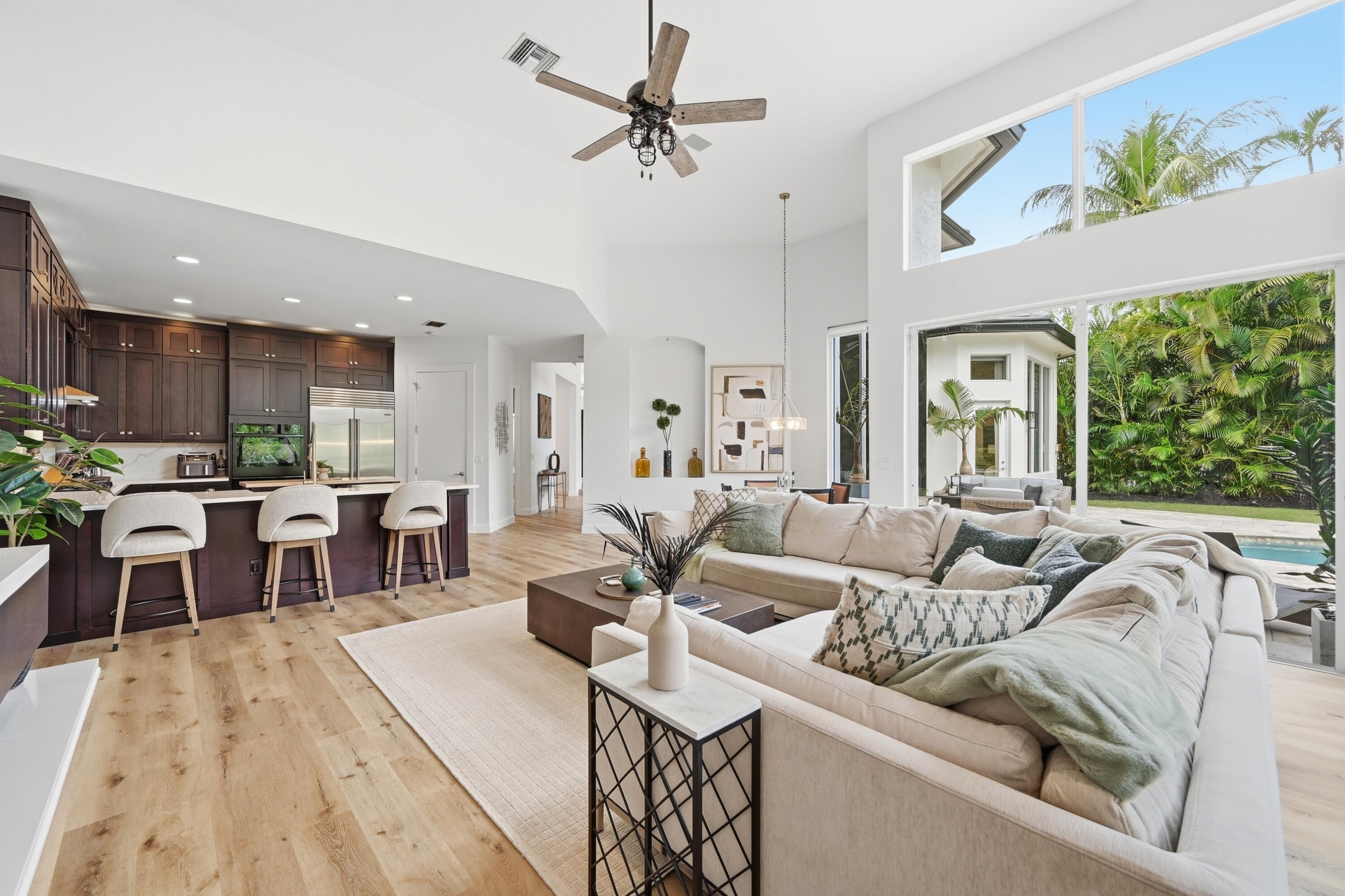 2399 Northwest 49th Lane Boca Raton, FL 33431 - Photo 24 of 75 a living room with furniture kitchen view and a large window