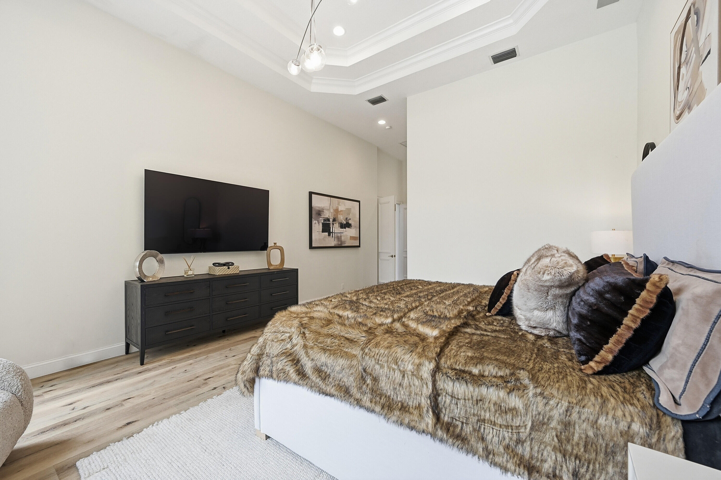 2399 Northwest 49th Lane Boca Raton, FL 33431 - Photo 29 of 75 a bedroom with a bed and a flat screen tv