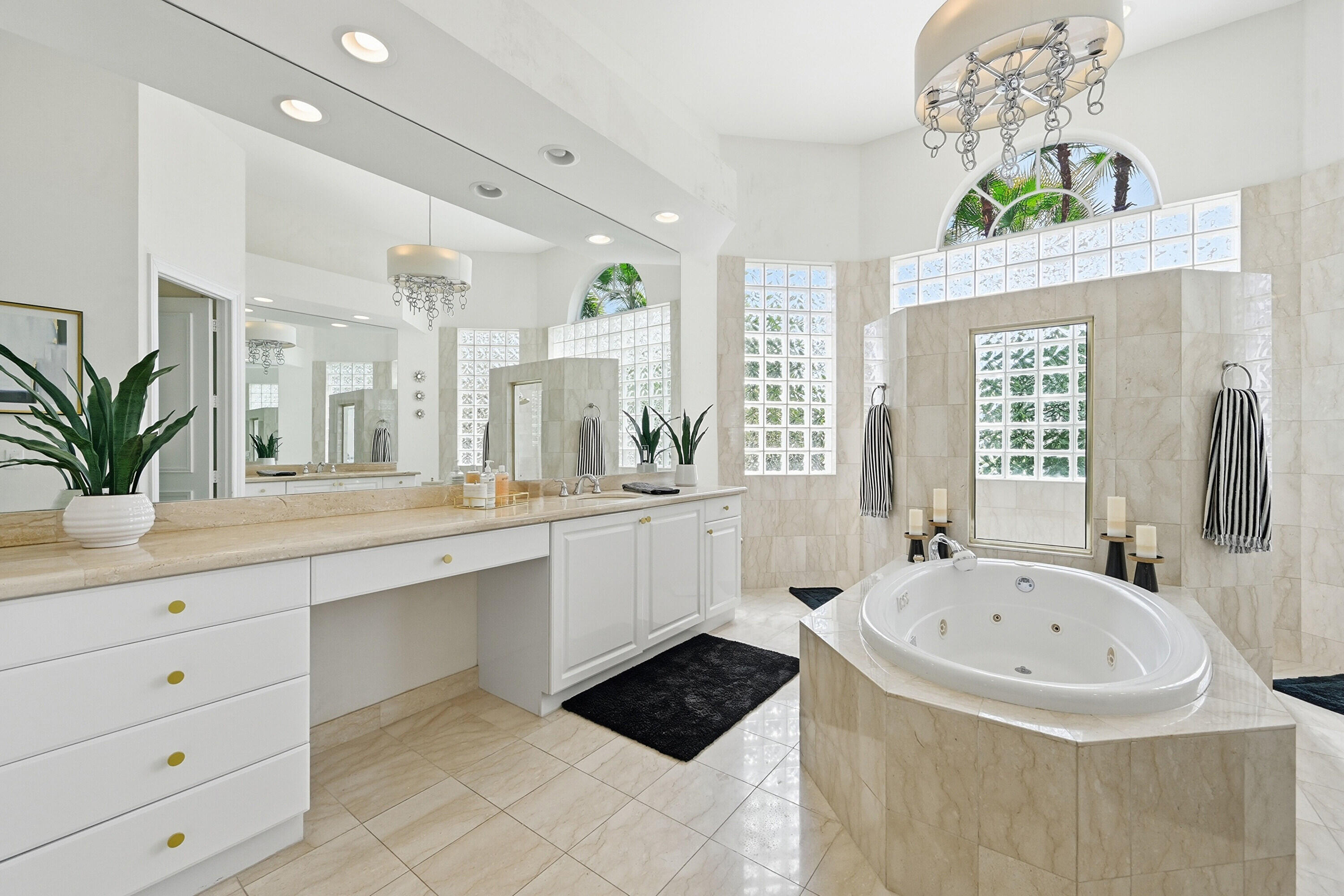 2399 Northwest 49th Lane Boca Raton, FL 33431 - Photo 34 of 75 a bathroom with a tub sink and mirror