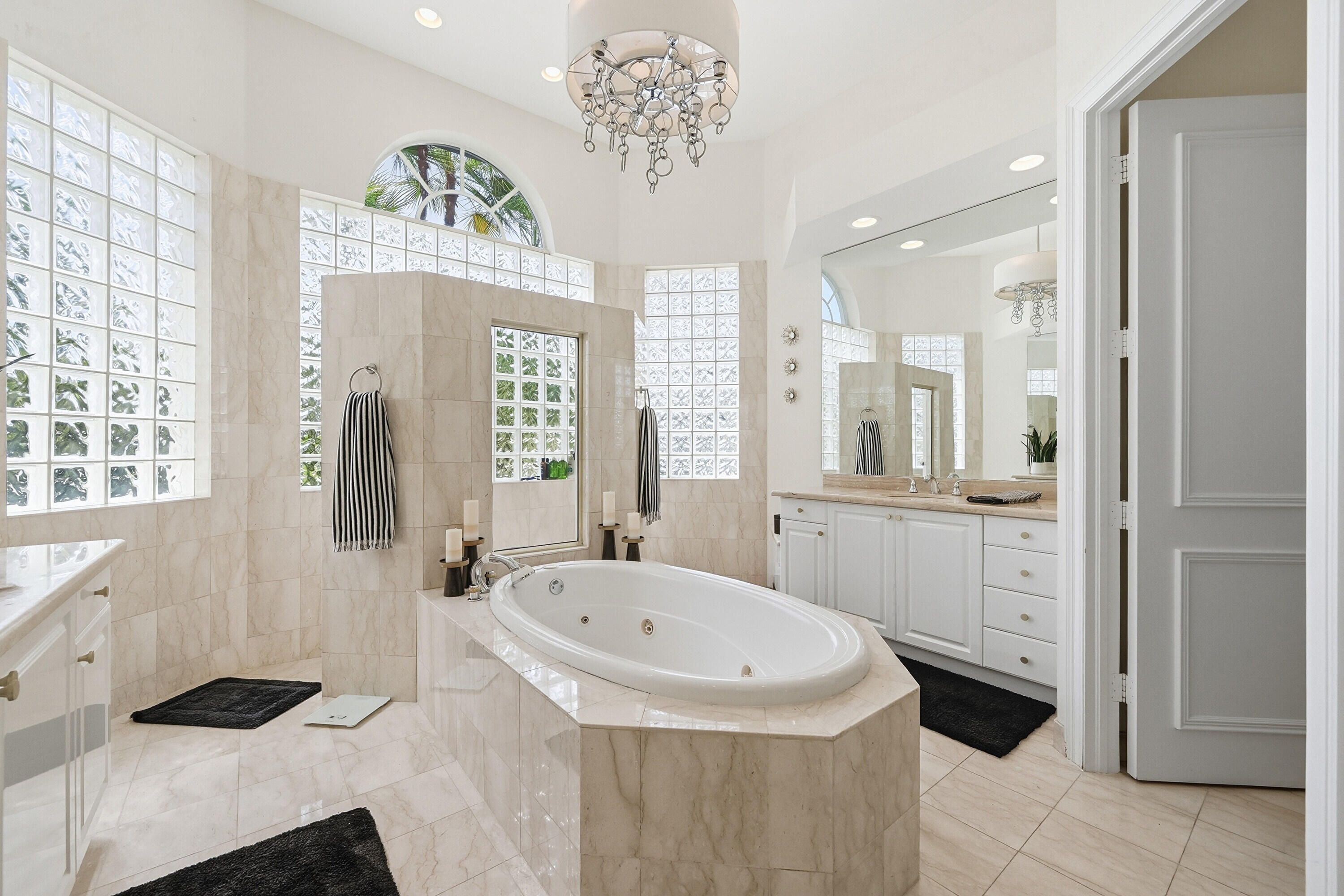 2399 Northwest 49th Lane Boca Raton, FL 33431 - Photo 35 of 75 a bathroom with a tub sink and mirror