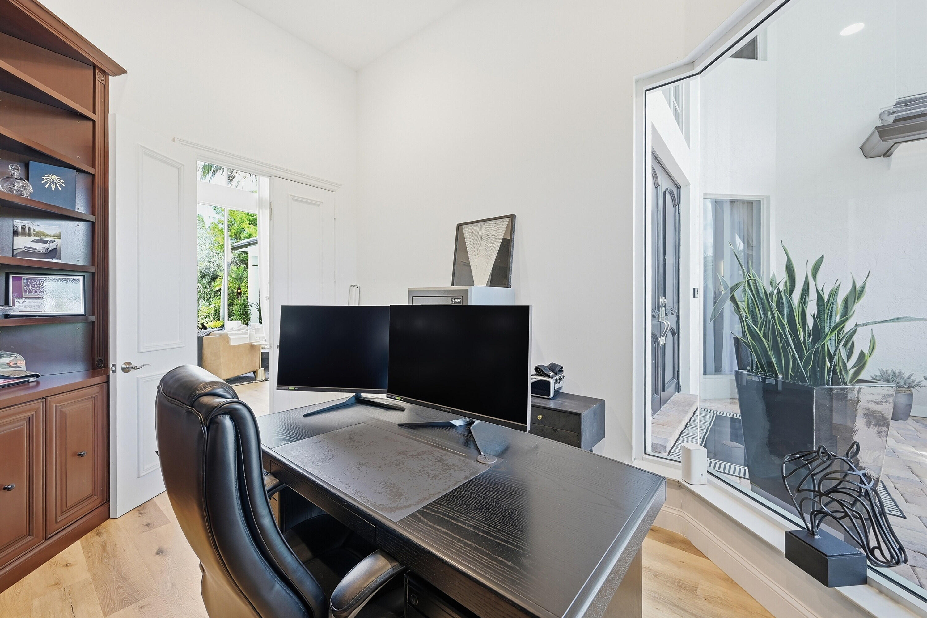 2399 Northwest 49th Lane Boca Raton, FL 33431 - Photo 40 of 75 a view of a workspace with furniture and a potted plant