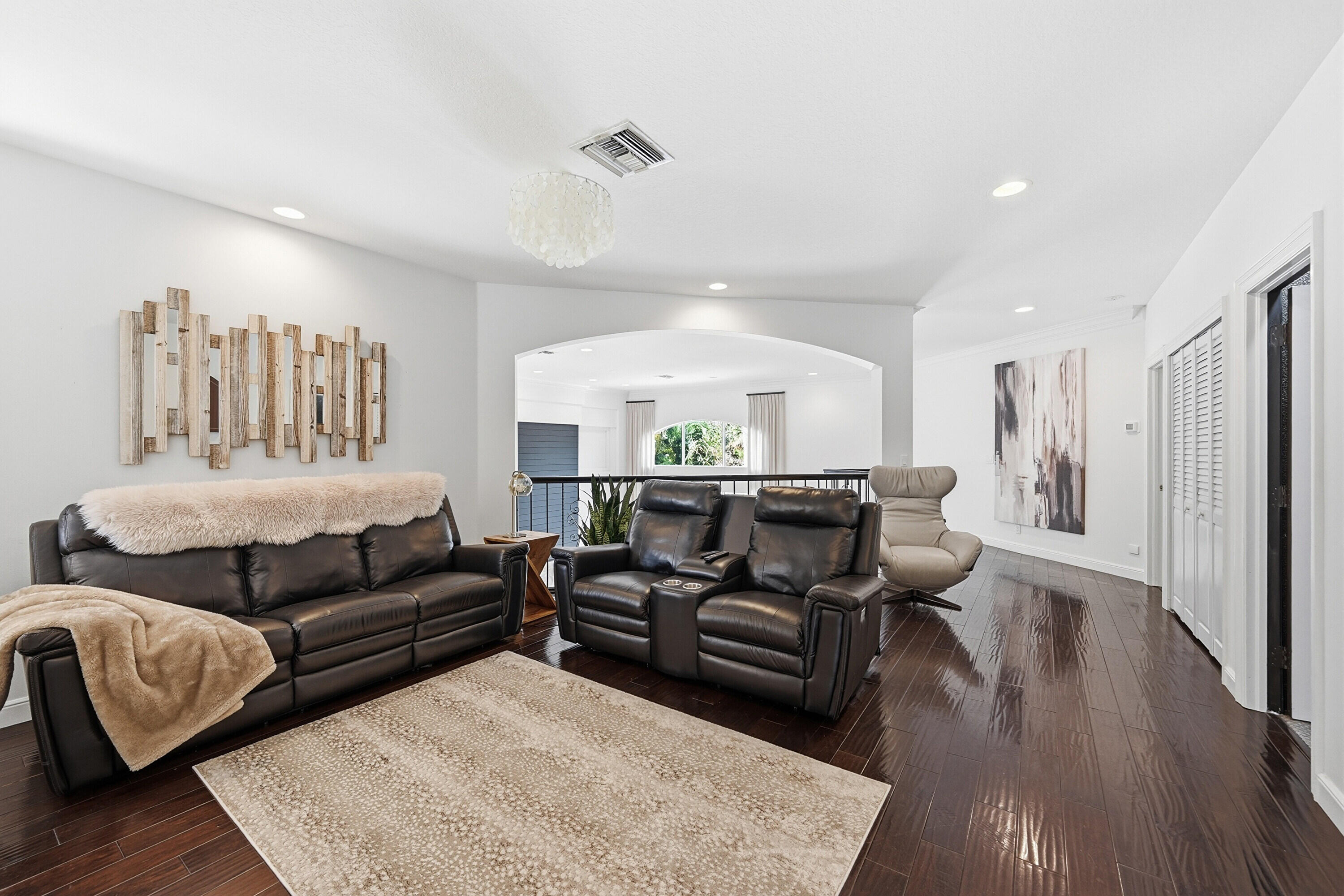 2399 Northwest 49th Lane Boca Raton, FL 33431 - Photo 45 of 75 a living room with furniture and a chandelier