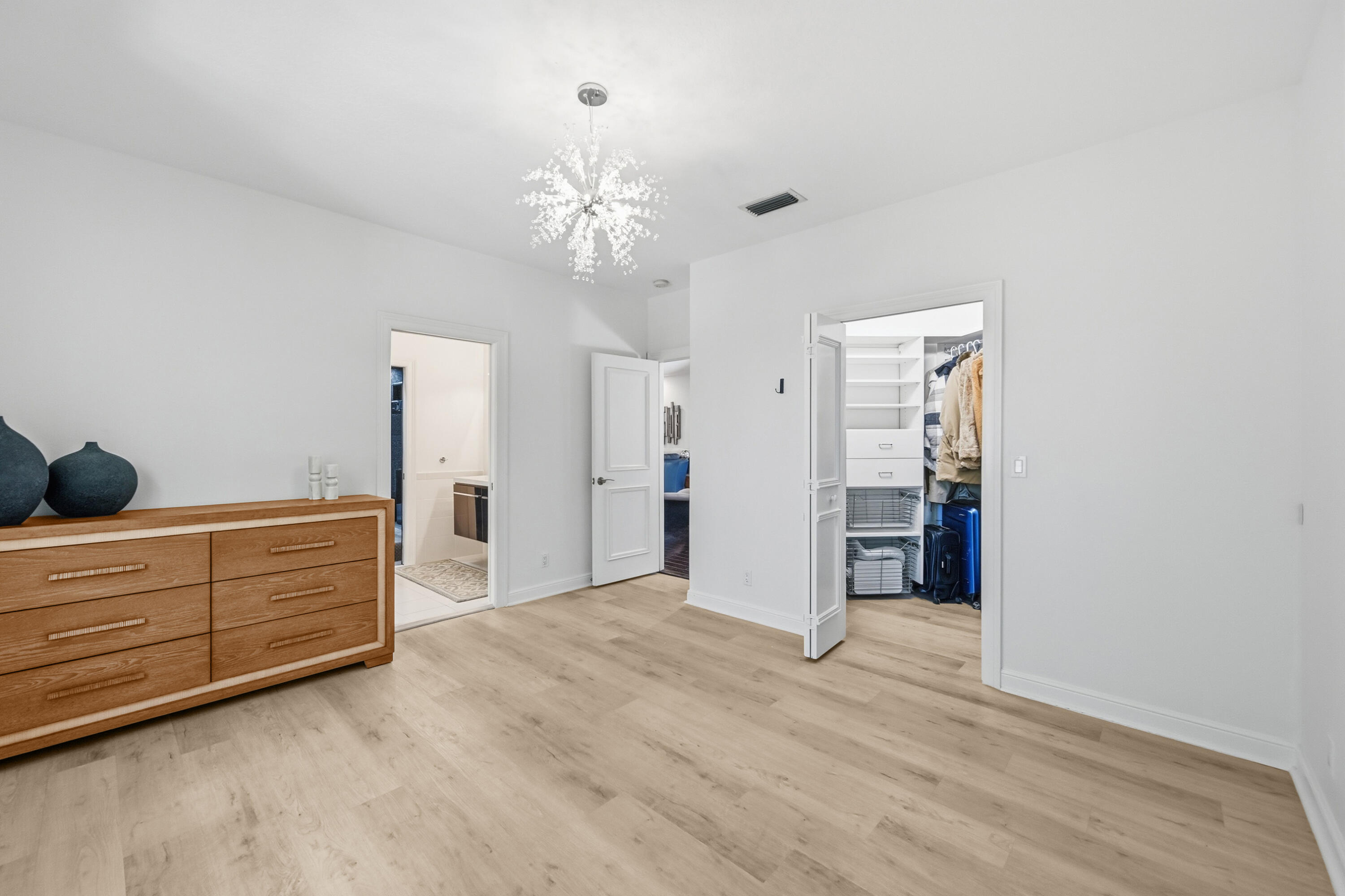 2399 Northwest 49th Lane Boca Raton, FL 33431 - Photo 48 of 75 a view of an empty room with closet and cabinet