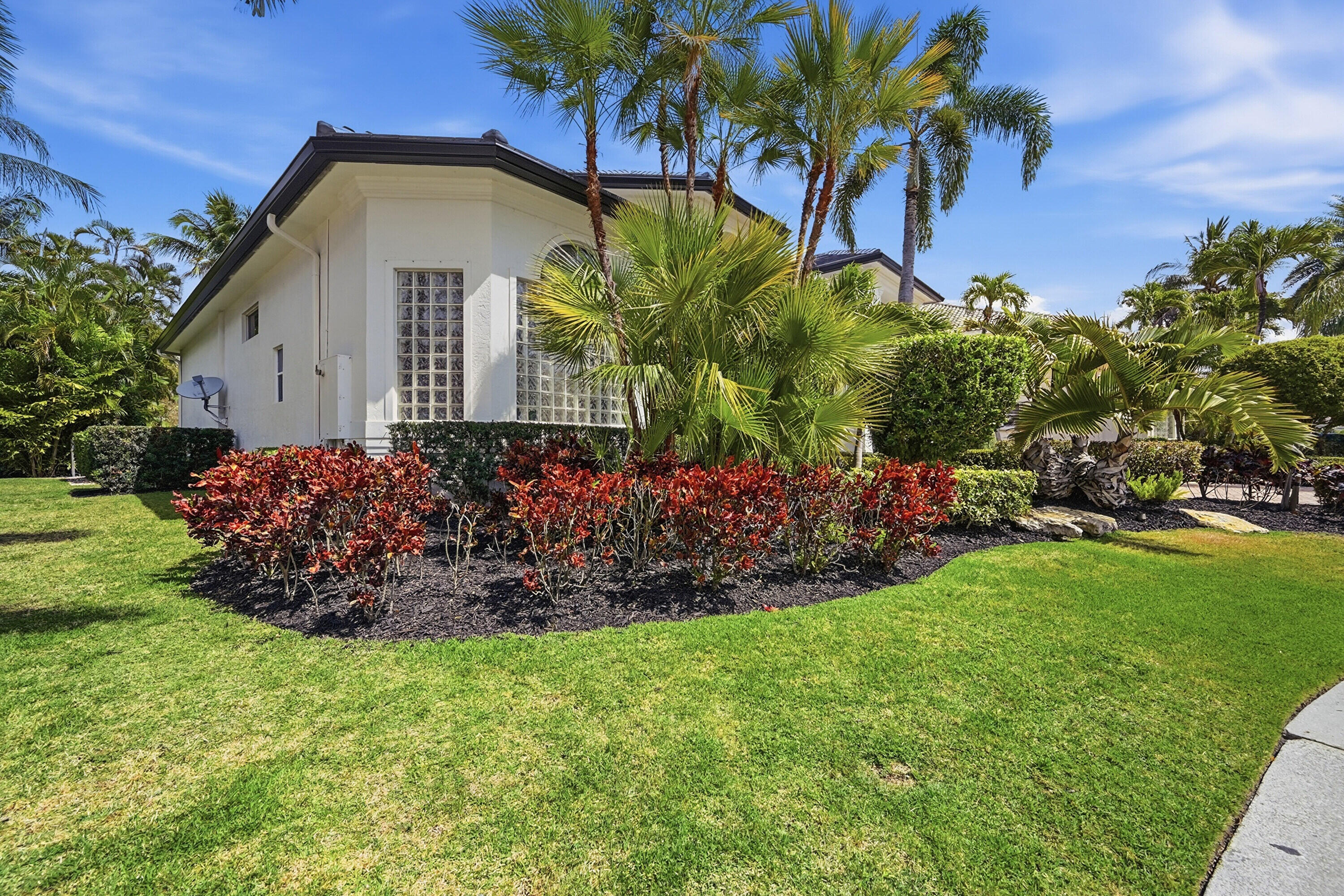 2399 Northwest 49th Lane Boca Raton, FL 33431 - Photo 5 of 75 a front view of a house with a garden