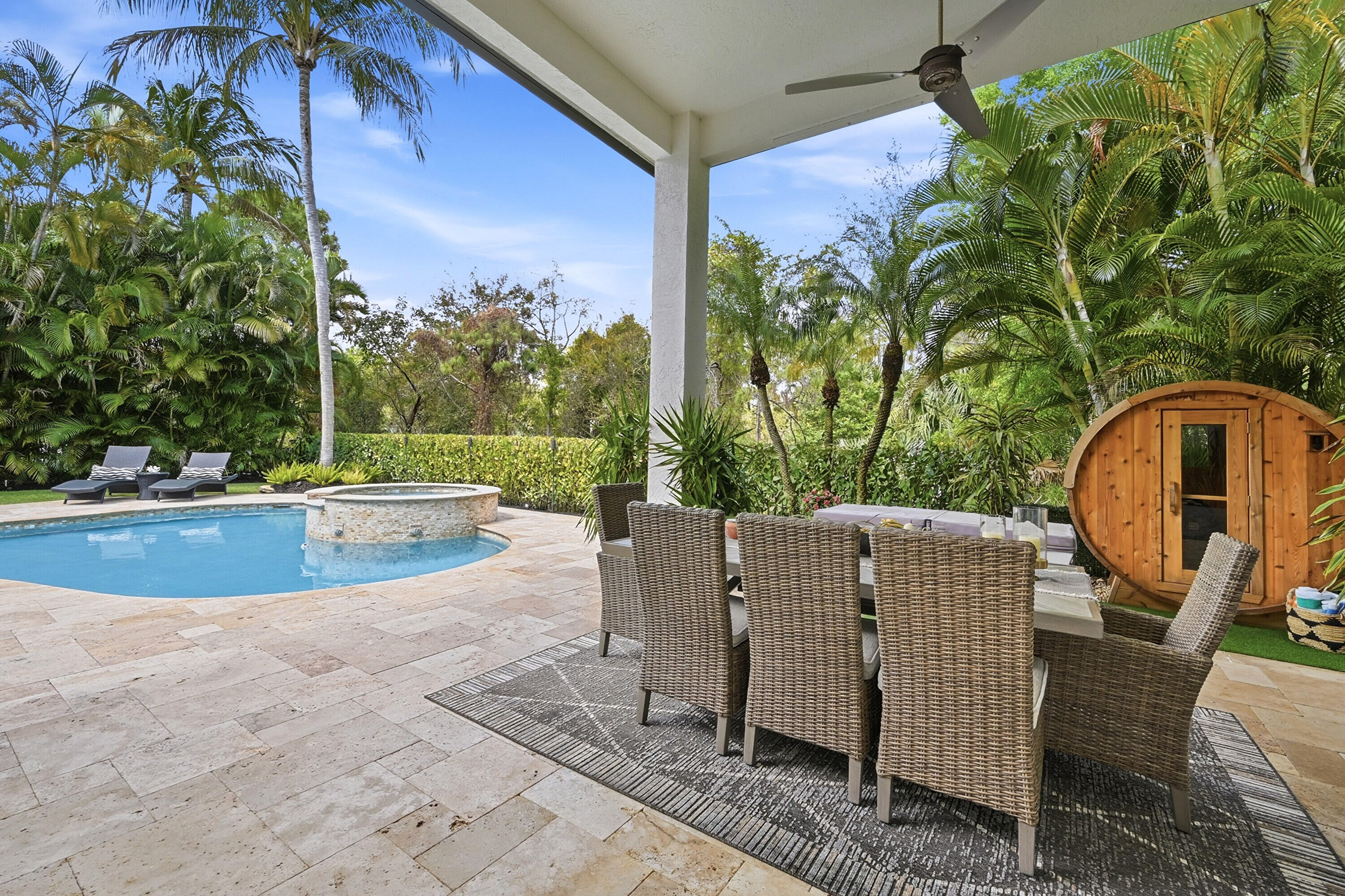 2399 Northwest 49th Lane Boca Raton, FL 33431 - Photo 58 of 75 a view of a swimming pool with a patio and a yard