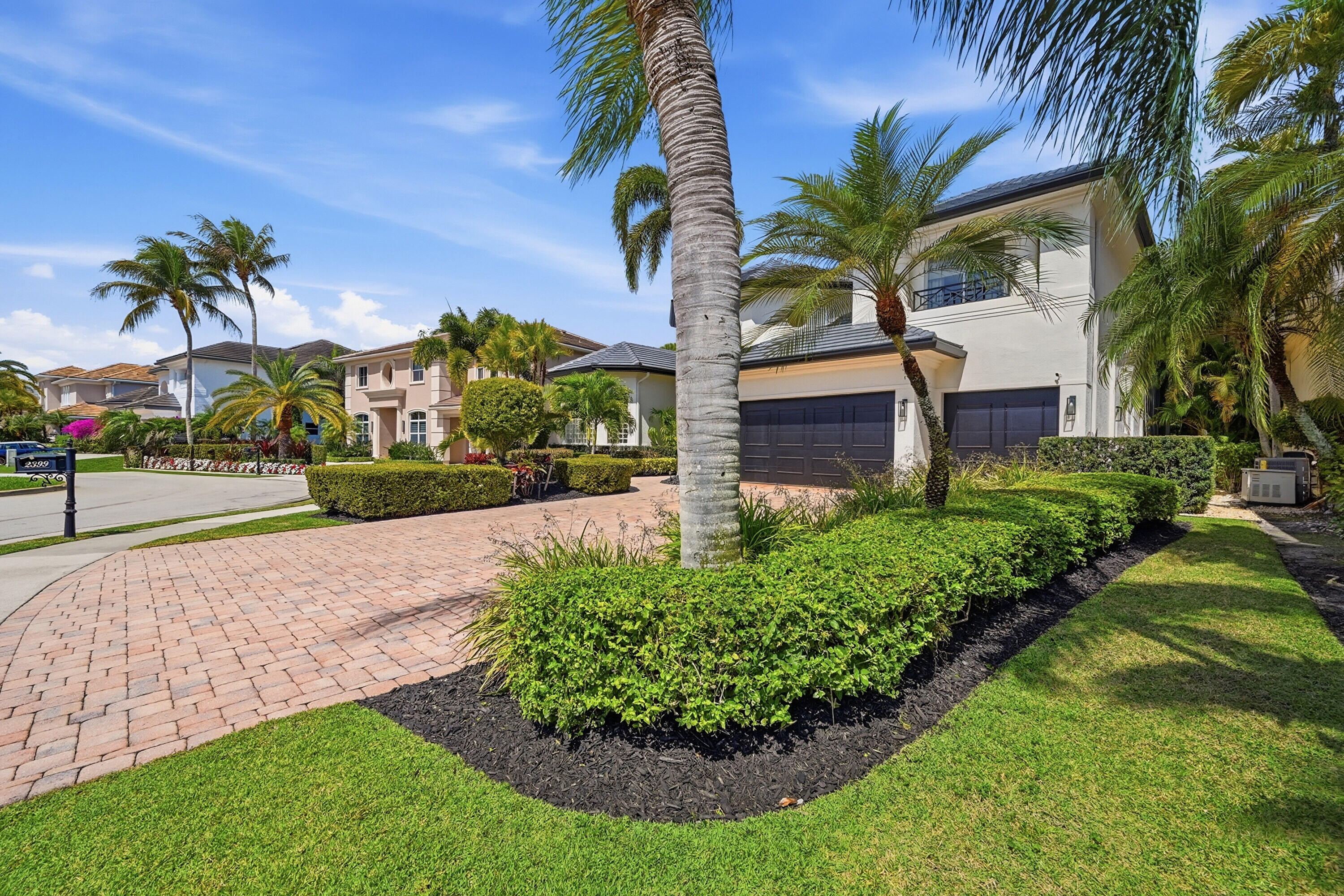 2399 Northwest 49th Lane Boca Raton, FL 33431 - Photo 6 of 75 a front view of a house with garden