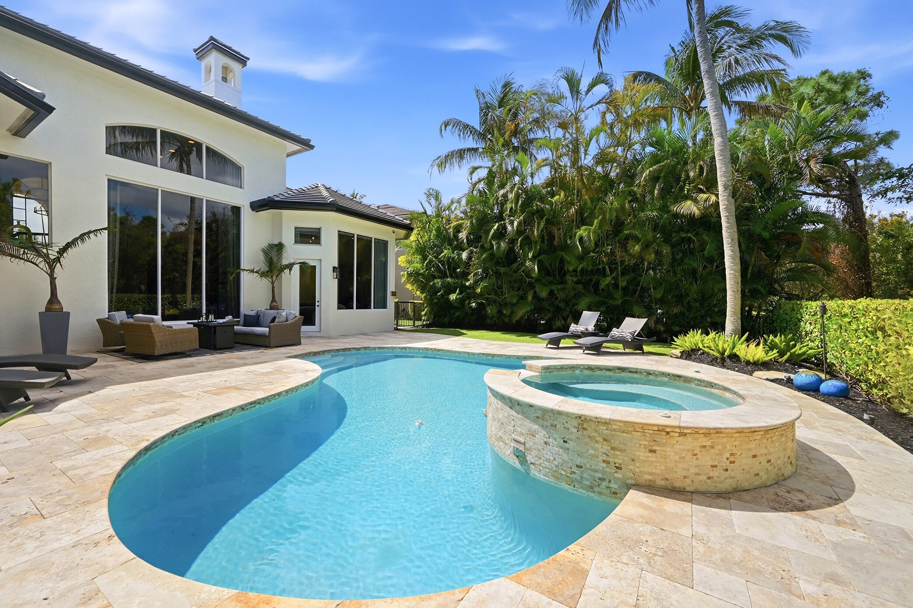 2399 Northwest 49th Lane Boca Raton, FL 33431 - Photo 61 of 75 a view of a house with swimming pool and sitting area