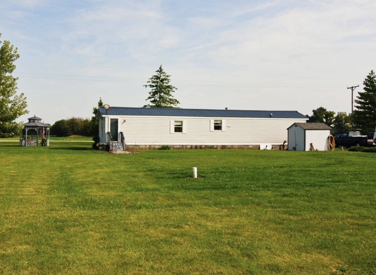 33850 East 2900 N Road Dwight, IL 60420 - Photo 12 of 16 a front view of a house with a garden and yard