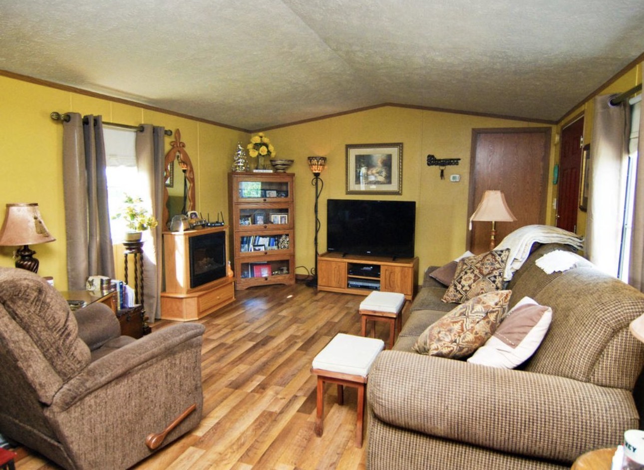 33850 East 2900 N Road Dwight, IL 60420 - Photo 4 of 16 a living room with furniture and a flat screen tv