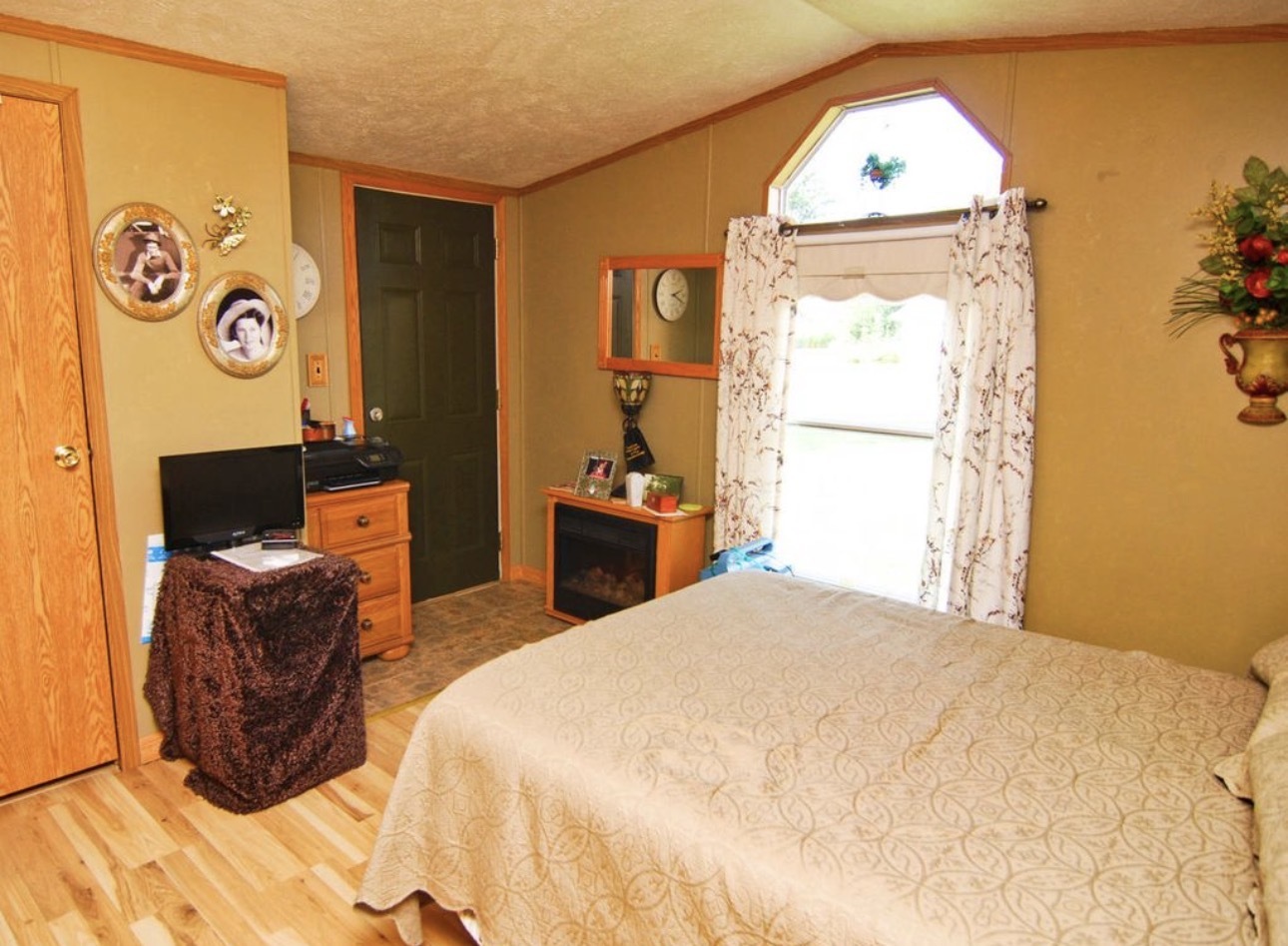 33850 East 2900 N Road Dwight, IL 60420 - Photo 9 of 16 a bedroom with a bed and a window